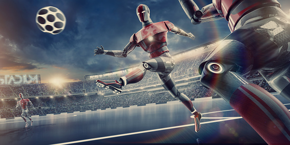 A futuristic soccer match between cyborgs showing robot in mid air having just kicked the football during a soccer match close to teammate. The action takes place in a generic outdoor soccer stadium during a football match under a stormy evening sky at sunset. All designs are generic.