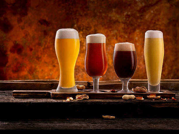 Beer Samplers Beer Samplers. Pilsner, Golden Honey Ale, Stout and Wheat Beer -Photographed on Hasselblad H3D2-39mb Camera beer styles stock pictures, royalty-free photos & images