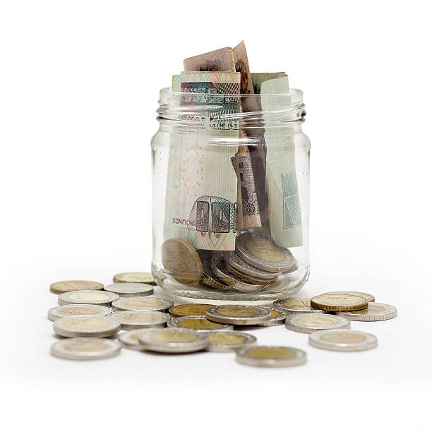 istock Egyptian Pounds, Coins and banknotes in Jar 637798162