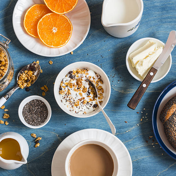 istock Yogurt with pumpkin granola, coffee on a blue table 637798222