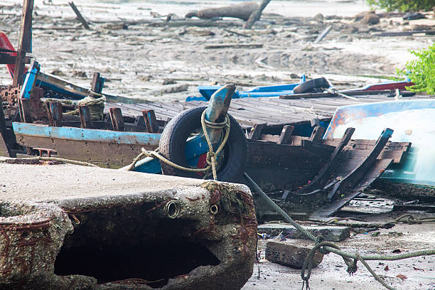 istock Broken abandoned fishing boat by the shore 637798246