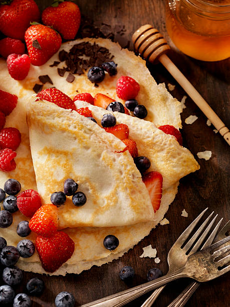 Crepes with Fresh Berries Crepes with Fresh Berries and Chocolate Sauce -Photographed on a Hasselblad H3D11-39 megapixel Camera System crêpe pancake stock pictures, royalty-free photos & images
