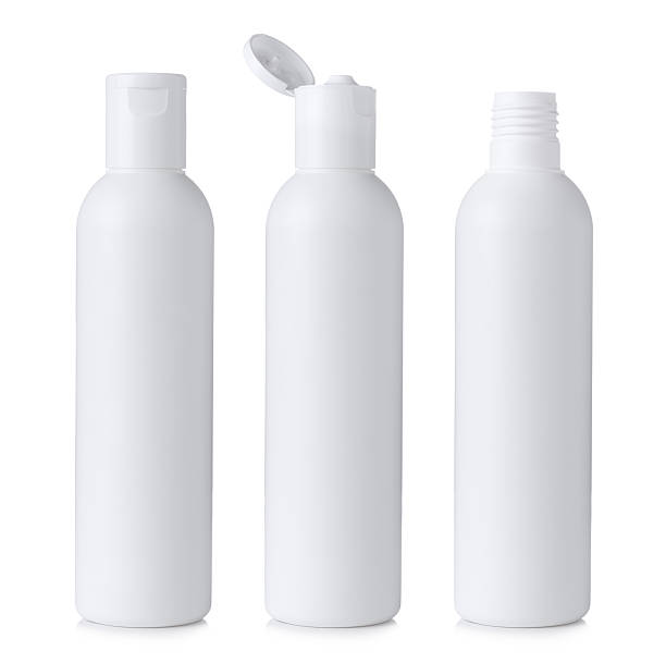 Blank white plastic cosmetics or shampoo bottles Blank white plastic cosmetics or shampoo bottle closed, open and without cap, isolated on white background white cap stock pictures, royalty-free photos & images