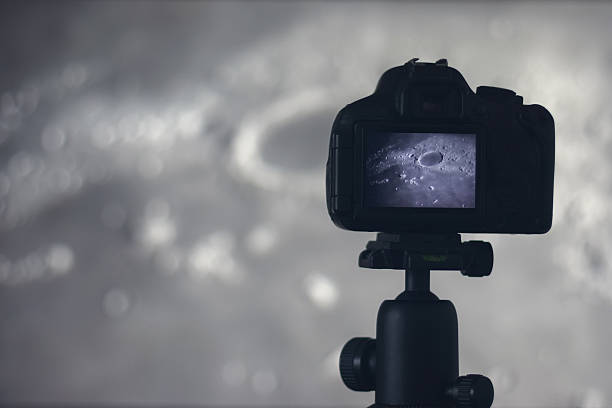 istock Moon photography. Camera with tripod capturing moon.  Moon Crater Plato 637804594