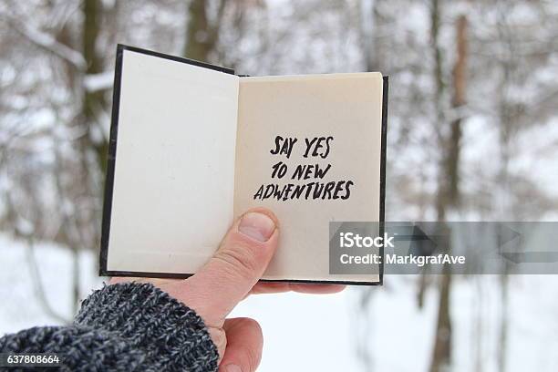 Male Holding A Book With The Inscription Say Yes To Stock Photo - Download Image Now