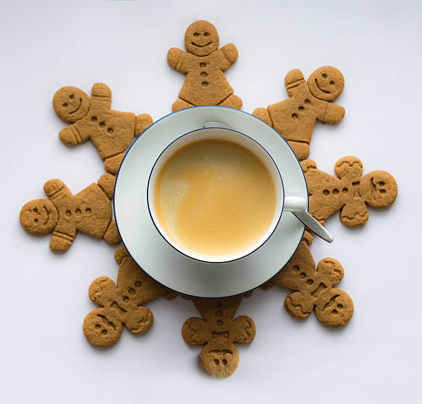 Coffee  cookies, gingerbread men 4 with  smiley and 4 moustache bow-tie around cup