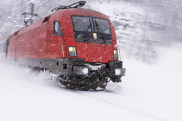 istock Fast Train in Heavy Snow Storm. Blizzard on Railway. 637812030