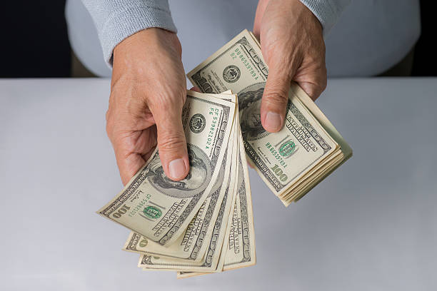 istock Man hand holding money,bribery concept. 637813308