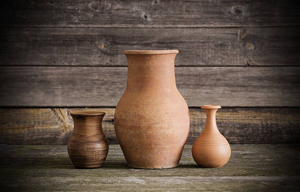 istock jugs on wooden background 637813460
