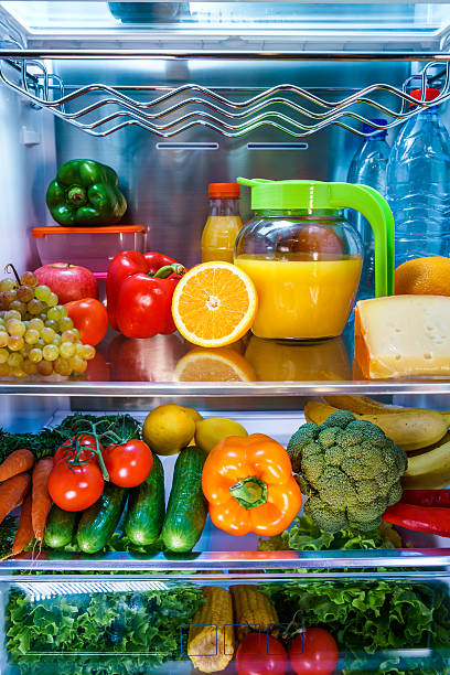 istock Open refrigerator filled with food 637813818