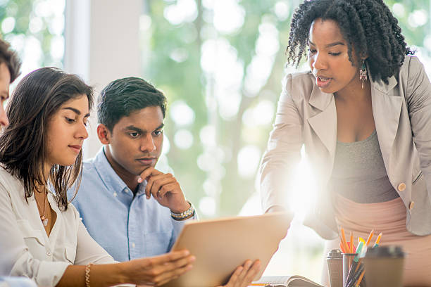 istock Women Leading a Team Meeting 637814636
