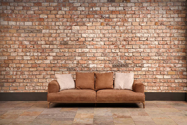 istock Photo wall mural stone wall sofa floor 637818364