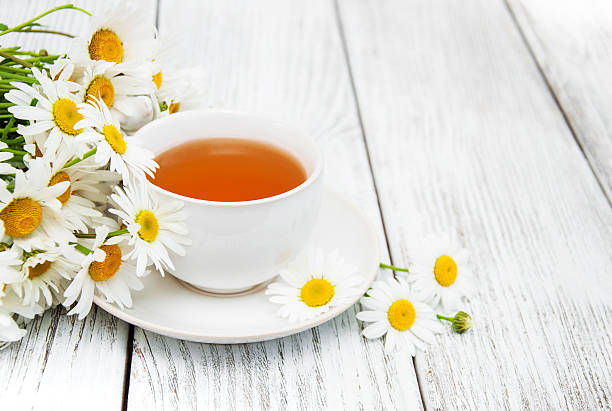 istock cup of herbal tea with chamomile flowers 637820298