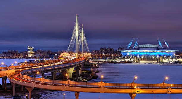 night city motorway, cable-stayed bridge and the football stadium. - cable stayed bridge imagens e fotografias de stock