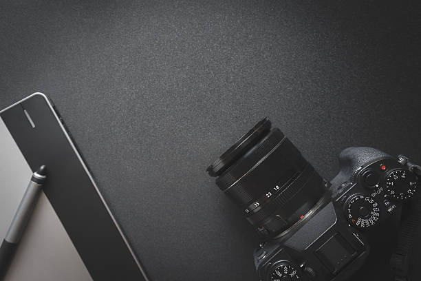 istock Workplace on dark table of a creative designer or photographer 637820982