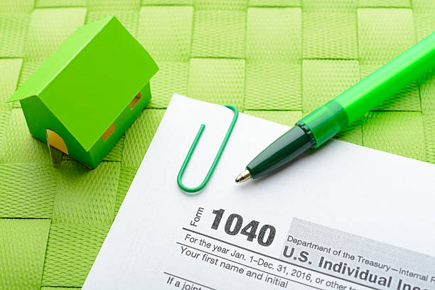 istock Paper house and tax form 637823266
