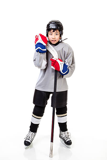 junior ice hockey player izolowane na białym tle - ice hockey child childhood little boys zdjęcia i obrazy z banku zdjęć