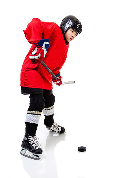 istock Junior Ice Hockey Player Isolated on White Background 637823876