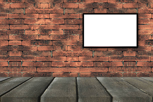 istock black frames on old brick wall with black wooden perspective 637825216