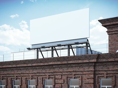 Blank billboard standing on classic brick building. 3d rendering
