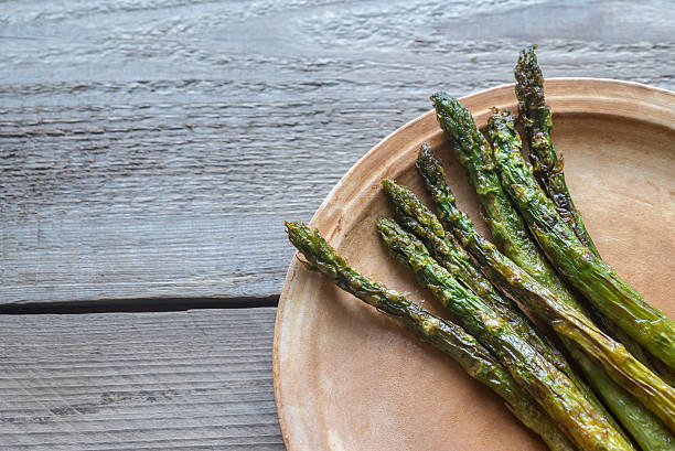 istock Roasted asparagus on the plate 637828330
