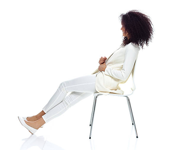 istock Smiling woman sitting on chair 637831530