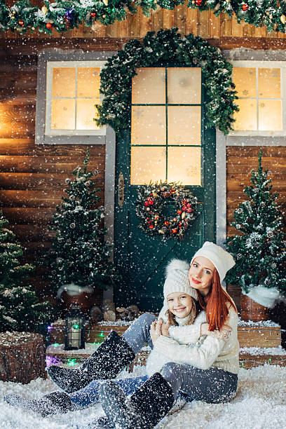 istock Mom and her daughter playing with snow 637834000