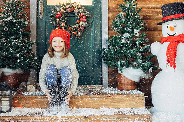 istock Little girl playing with snow 637834178