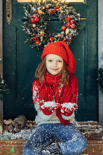 istock Little girl playing with snow 637834362