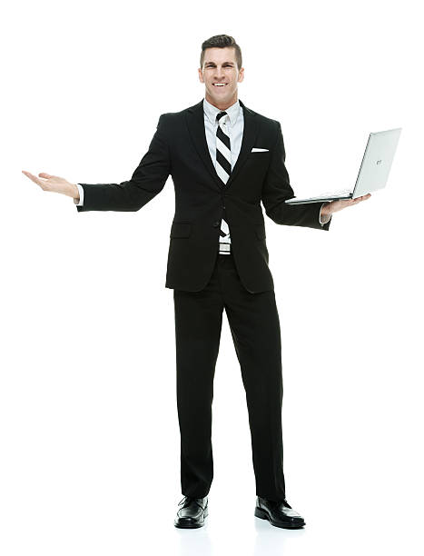 istock Smiling businessman holding laptop 637834806