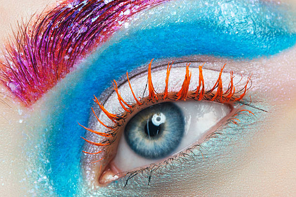 Close-up studio shot of woman eye Close-up studio shot of woman eye. crazy makeup stock pictures, royalty-free photos & images
