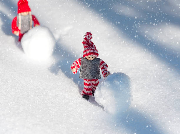 istock Two toy little men playing in the snow, snowfall 637836060