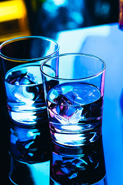 istock drinking glasses close-up on a dark background 637836304