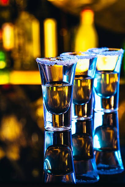 istock stack of tequila with salt close up on blurred background 637836364
