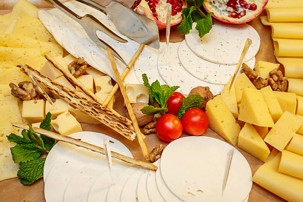 istock Cheese plate with variety of appetizers on table 637837410