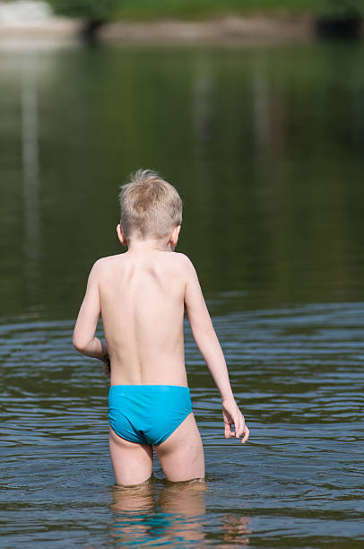 istock Six years boy rear view 637838884