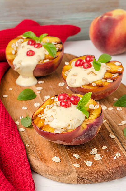 istock Delicious grilled peaches dessert with yogurt, gooseberries and 637841300