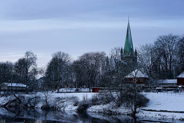 istock Snow Covered Riverbank With Church 637841592