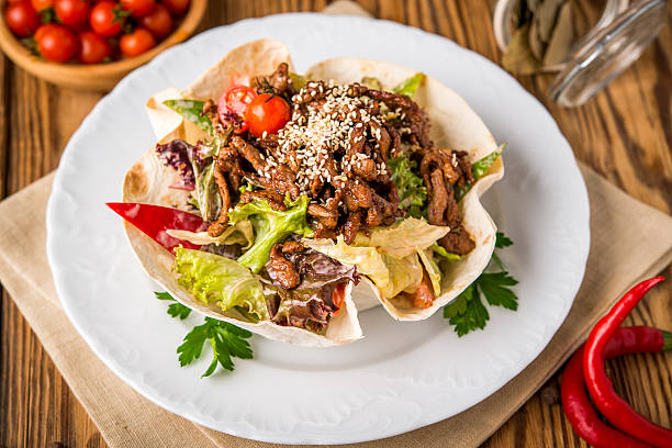 istock fried chicken meat with vegetables in pita bread 637842432
