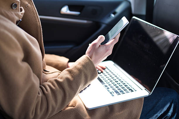 istock young asian man  hold mobile phone in car 637844796