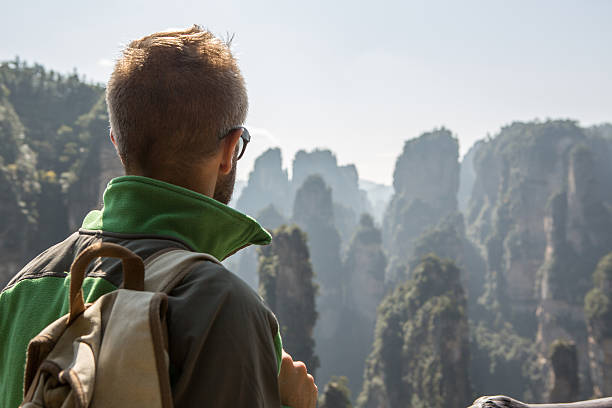 istock Hiker looking at majestic mountain landscape 637845780