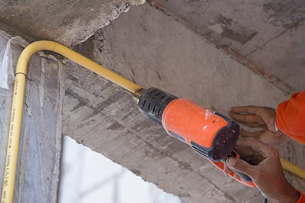 istock Hand use a heat gun to bending electric PVC pipe 637848468