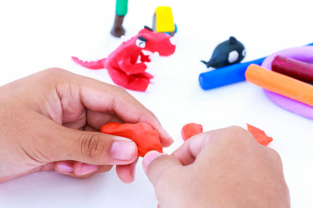 istock Child molding modeling clay, on white background. Strengthen the 637850956