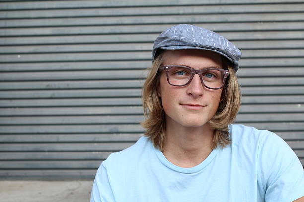 istock Long haired blond male wearing glasses 637851532