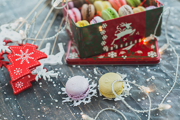 istock Christmas background with macaroons garlands and snow 637853862