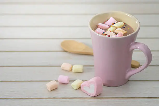 Hot chocolate with marshmallows in a ceramic cup with copy space to write, Valentine concept, AF point selection.