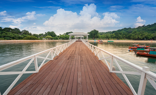 The long wooden bridge over the sea with a beautiful sunlight, Koh Si Chang island , Sriracha Chonburi.Thailand