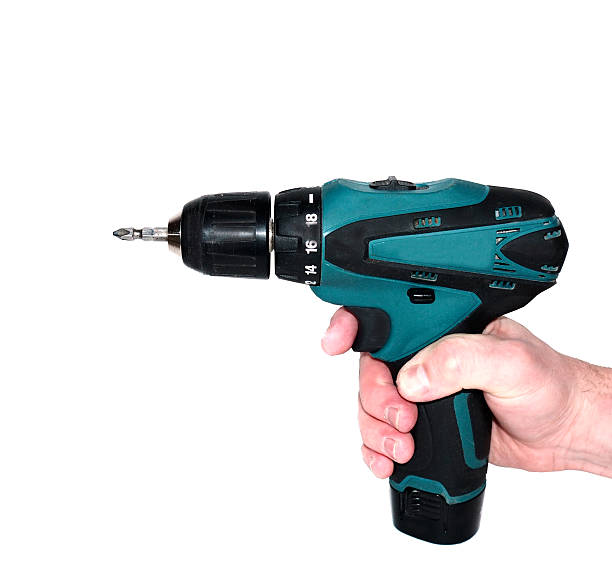 istock screwdriver in the hand isolated on white background 637857880