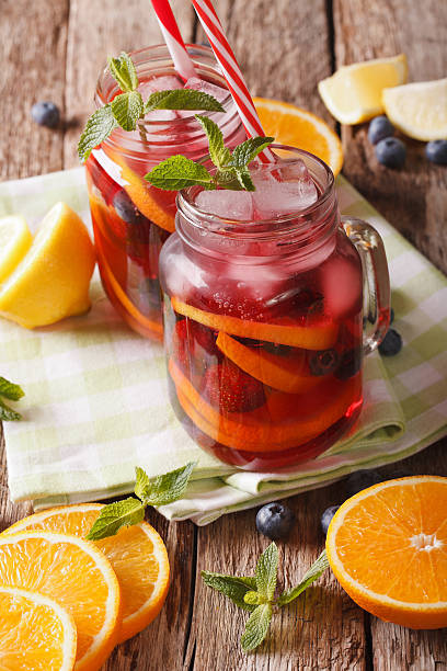 istock Cold alcoholic drink sangria closeup in a glass jar. vertical 637858946