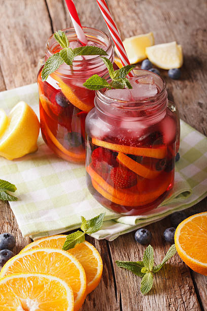 istock Sangria with fruit and berries, ice and mint closeup 637858982